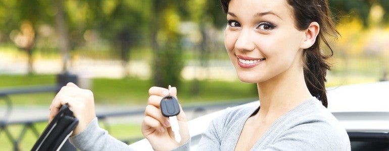 Woman holding car keys
